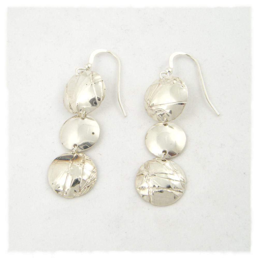Three domed pressed wire earrings